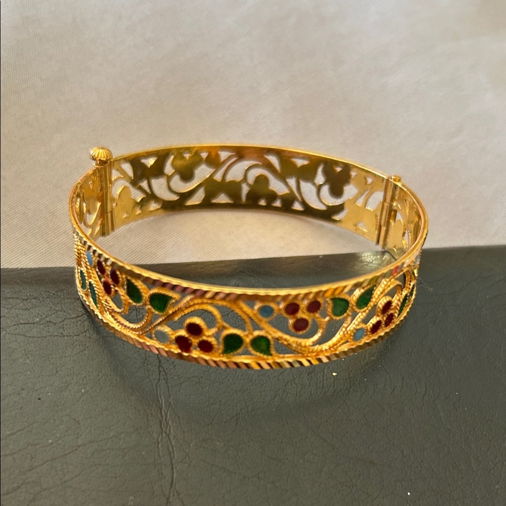 Elegant Gold Filigree Bracelet with Green and Red Accents. This bangle is 22 k.
